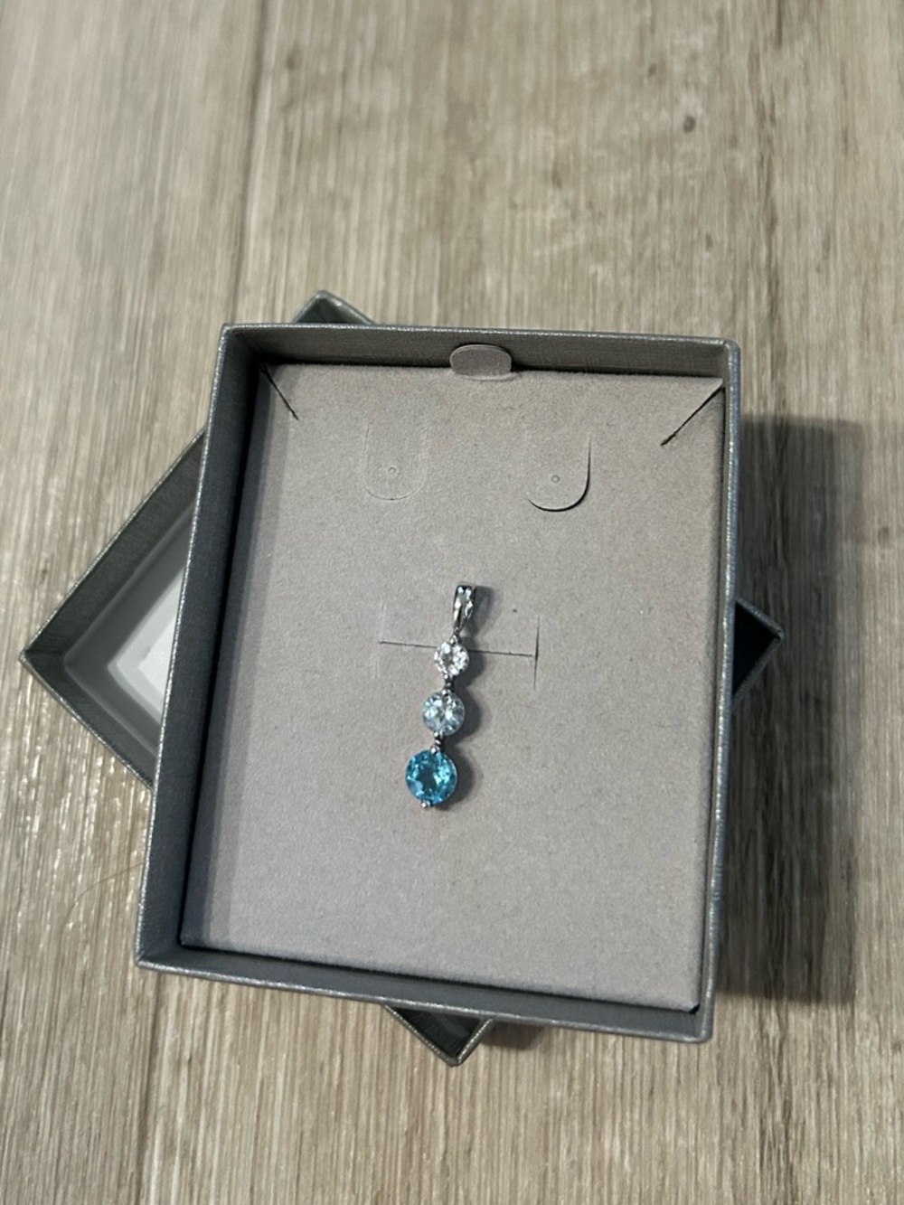Zales Natural Blue and White Topaz Three Stone Pendant